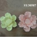 Delicate decorative ceramic flowers adorn