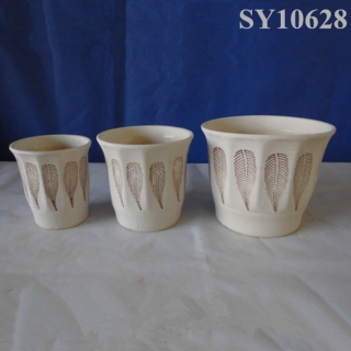 cream round ceramic planters and pots