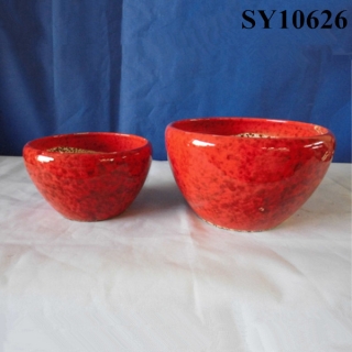 bright red bowl shaped planter