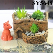 Cement cabin shaped house plant pot